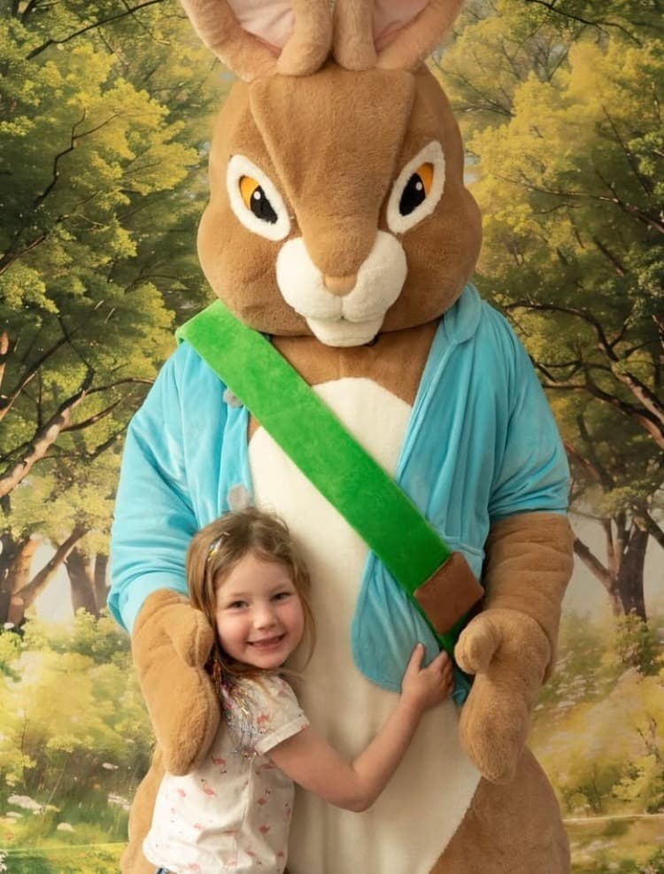 A child hugging the Easter Bunny